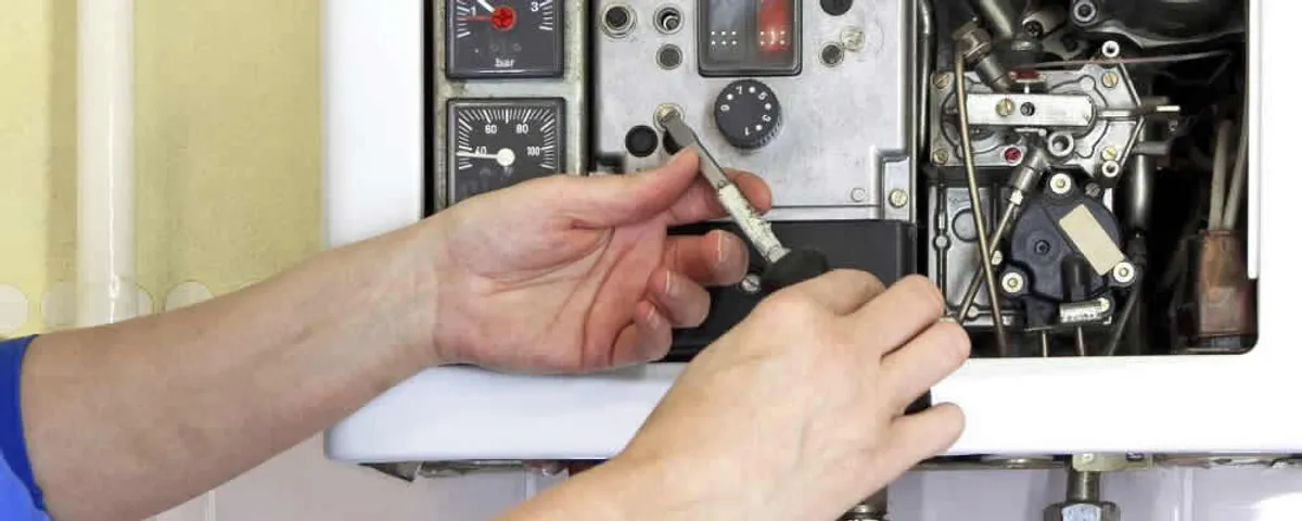Heating repair technician adjusting boiler controls and components in Clearwater, FL