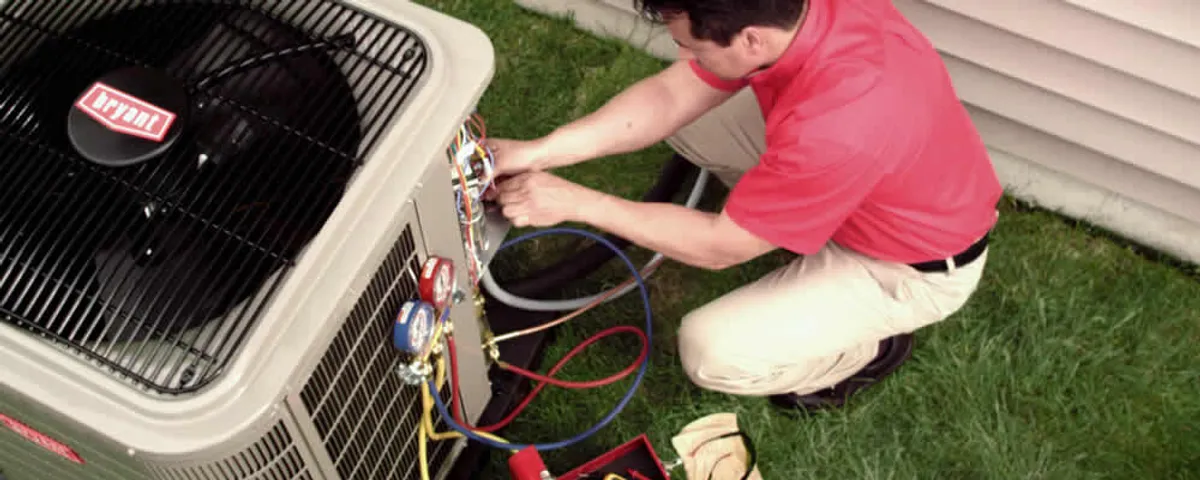 HVAC technician servicing an outdoor air conditioner unit in Clearwater, FL